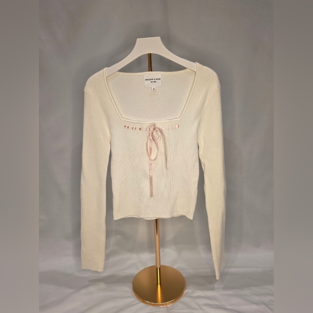 Elegant Cream Long Sleeve Top with Pink Ribbon